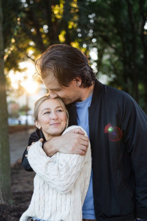 couple poses for an engagement photo after just having a surprise proposal