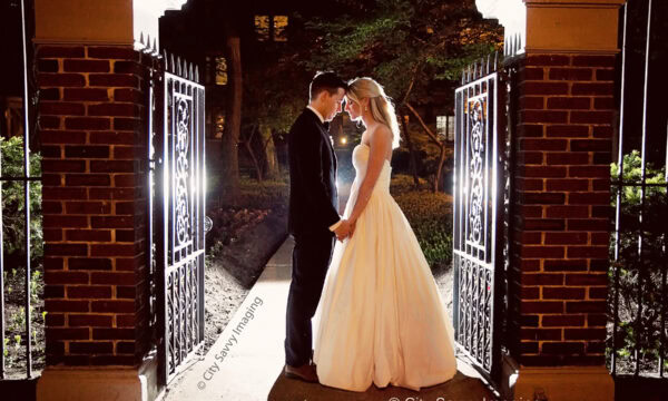 Under the glow of an illuminated entrance, Patrick and Rachel stood hand in hand, embodying the essence of a timeless Chicago wedding.