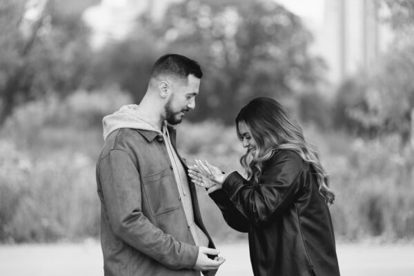 a couple shares a look of shock after the groom to be proposed to his partner