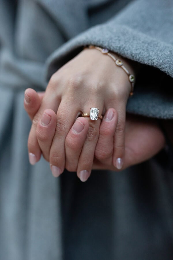 Close-up of a radiant-cut diamond engagement ring on a woman's hand after a Chicago proposal