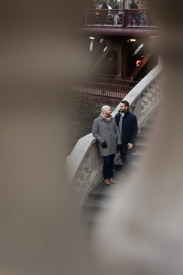 Couple on Chicago Riverwalk posing for an engagement photo